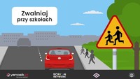 kolorowy plakat, widok na drogę, z prawej strony znak &quot;uwaga dzieci&quot;, drogą jedzie czerwone auto osobowe;